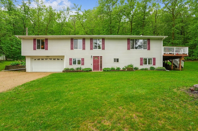 W10005 710th Ave, River Falls, WI 54022 - view of front of house with stairs, driveway, a wooden deck, an attached garage, and a front lawn