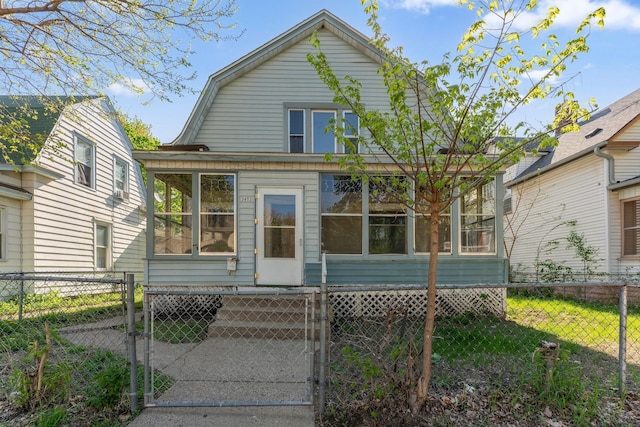 3413 Columbus Ave, Minneapolis, MN 55407 - back of house featuring a sunroom, a gate, and a fenced front yard