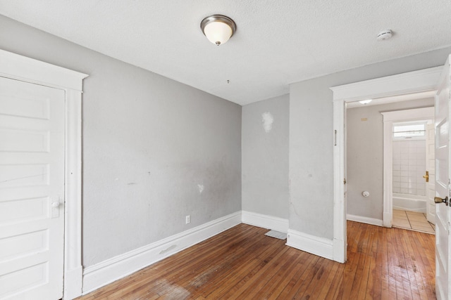 3413 Columbus Ave, Minneapolis, MN 55407 - spare room featuring a smoke detector, hardwood / wood-style flooring, and baseboards