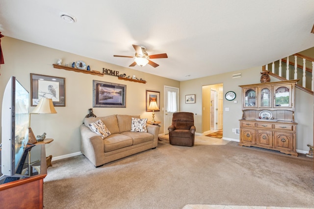 27180 Lakewood Dr NW, Stanford Twp, MN 55040 - living room featuring ceiling fan, carpet floors, stairway, and baseboards
