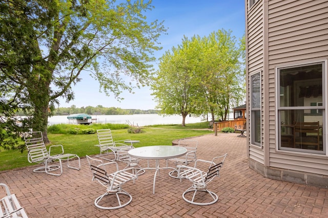 27180 Lakewood Dr NW, Stanford Twp, MN 55040 - view of patio featuring a water view and outdoor dining area
