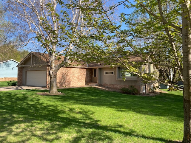 875 20th St, Windom, MN 56101 - view of front facade with concrete driveway, a front lawn, and an attached garage