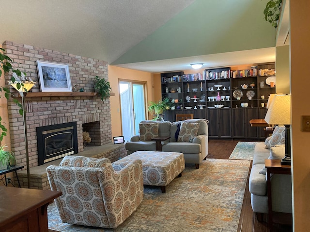 875 20th St, Windom, MN 56101 - living room with lofted ceiling, a fireplace, and wood finished floors