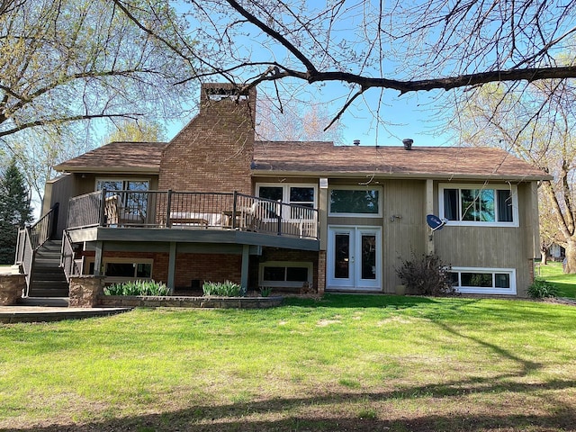 875 20th St, Windom, MN 56101 - rear view of house featuring a yard, a chimney, a deck, and stairs
