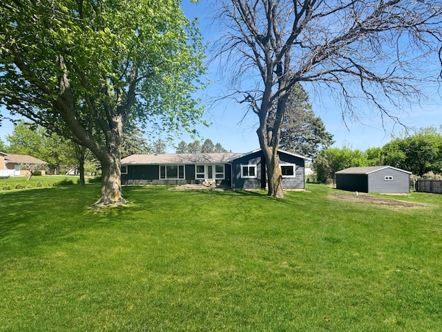1539 111th St, Slayton Twp, MN 56172 - rear view of house featuring a yard and an outdoor structure