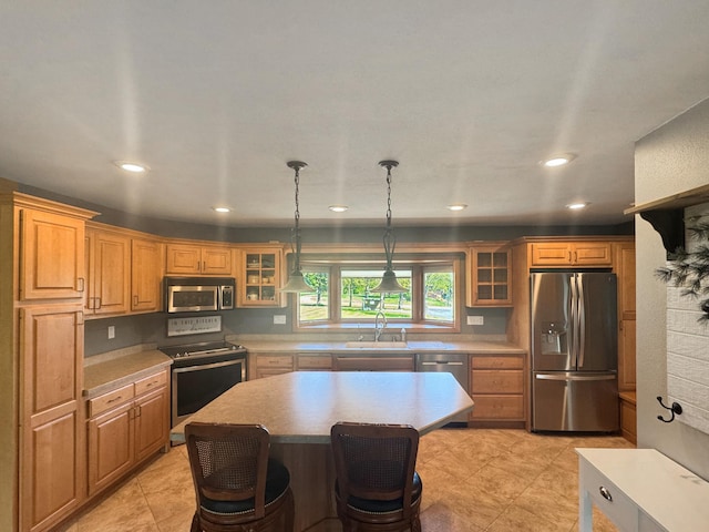 1539 111th St, Slayton Twp, MN 56172 - kitchen with appliances with stainless steel finishes, a sink, light countertops, glass insert cabinets, and recessed lighting