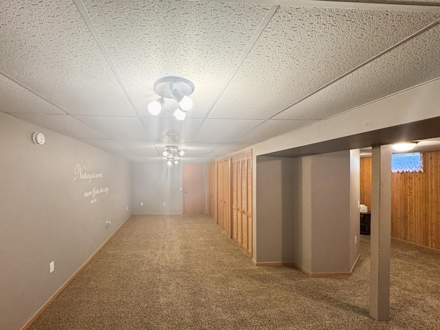 1539 111th St, Slayton Twp, MN 56172 - finished below grade area with carpet flooring, a drop ceiling, and baseboards