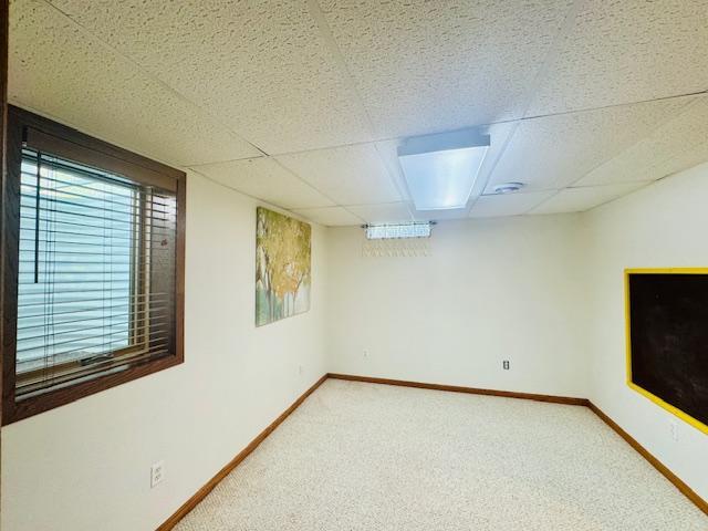 1539 111th St, Slayton Twp, MN 56172 - basement featuring carpet floors, baseboards, and a drop ceiling