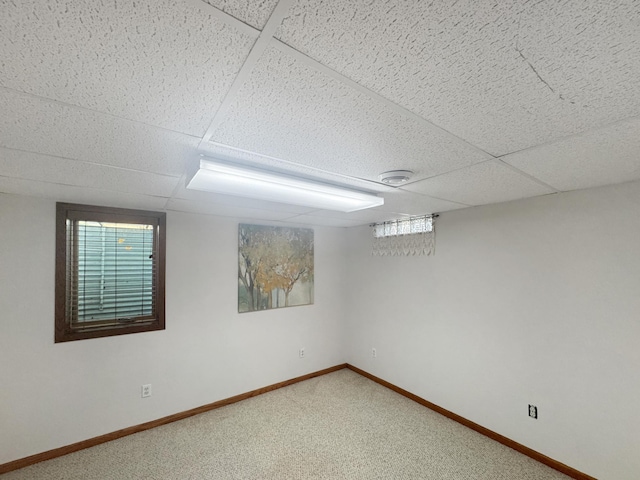 1539 111th St, Slayton Twp, MN 56172 - below grade area featuring a paneled ceiling, carpet floors, baseboards, and healthy amount of natural light