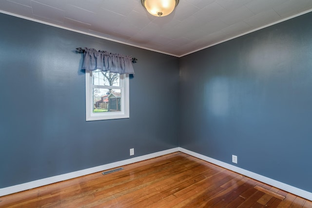 5433 511th Street Way, Kenyon Twp, MN 55946 - unfurnished room featuring wood-type flooring and ornamental molding