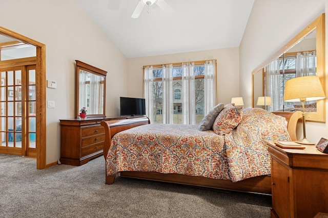 carpeted bedroom with a ceiling fan and high vaulted ceiling