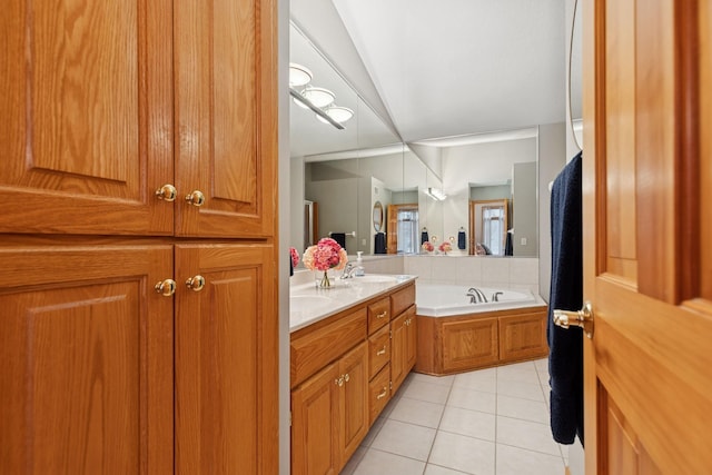 full bathroom with tile patterned floors, double vanity, and a bath