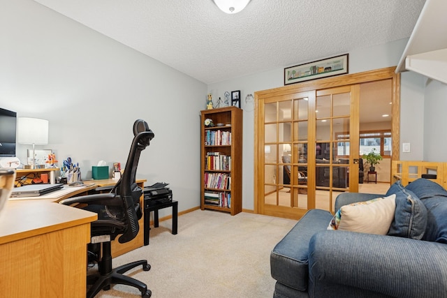 office space with french doors, light carpet, a textured ceiling, and baseboards