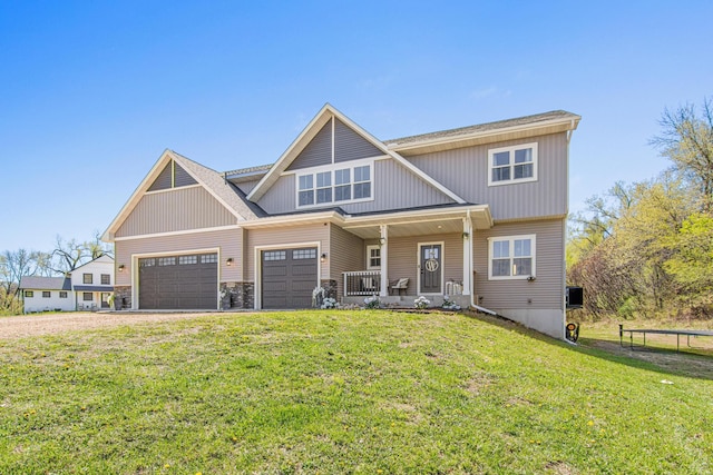 968 150th Ave, New Richmond, WI 54017 - view of front of property with a porch, a front lawn, stone siding, and an attached garage