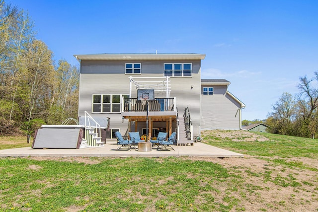 968 150th Ave, New Richmond, WI 54017 - back of house with a patio area, a lawn, a hot tub, and a deck