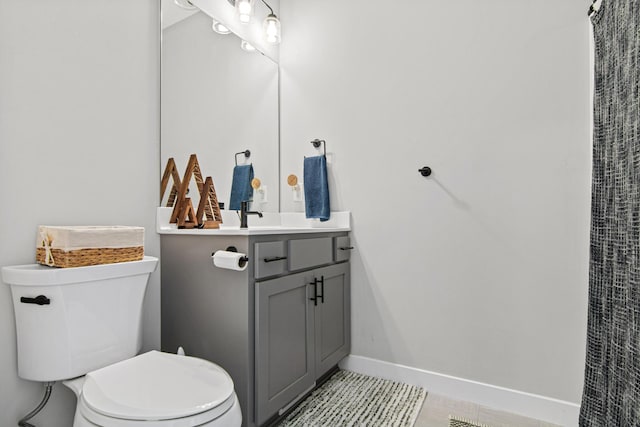 968 150th Ave, New Richmond, WI 54017 - full bath with toilet, baseboards, vanity, and tile patterned floors