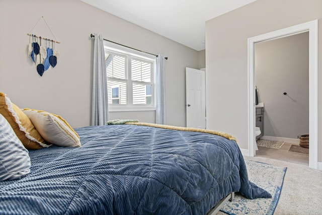 968 150th Ave, New Richmond, WI 54017 - carpeted bedroom featuring ensuite bathroom and baseboards