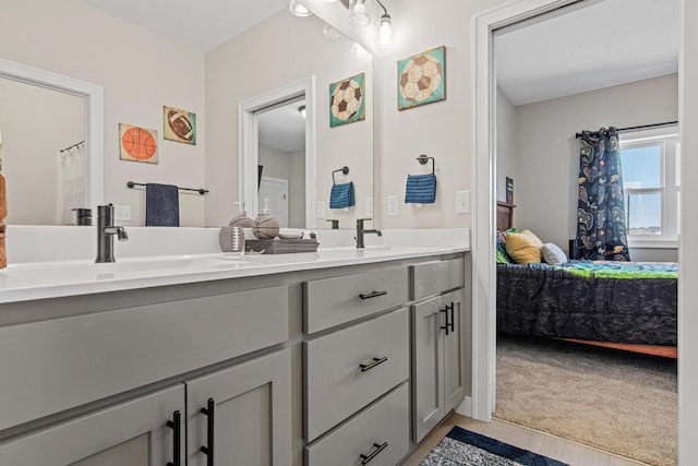 968 150th Ave, New Richmond, WI 54017 - ensuite bathroom featuring double vanity and tile patterned floors