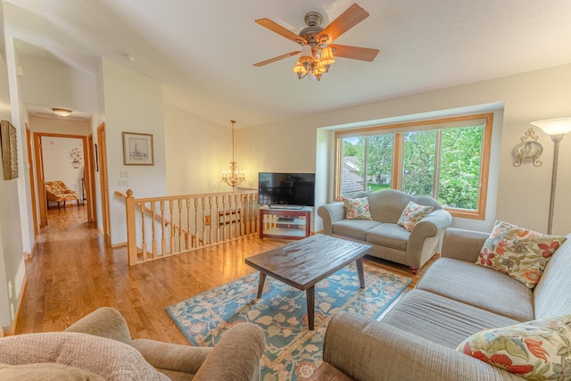 1434 Benson Blvd E, Stillwater, MN 55082 - living area with wood finished floors, lofted ceiling, ceiling fan, and a chandelier