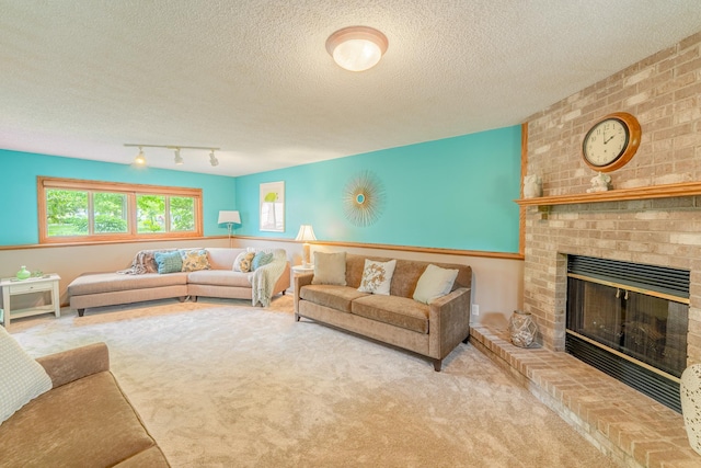 1434 Benson Blvd E, Stillwater, MN 55082 - carpeted living area featuring a brick fireplace, a textured ceiling, and track lighting