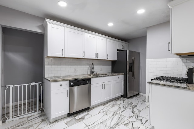 5548 34th Ave S, Minneapolis, MN 55417 - kitchen featuring stainless steel appliances, a sink, light marble finish flooring, recessed lighting, and light stone counters