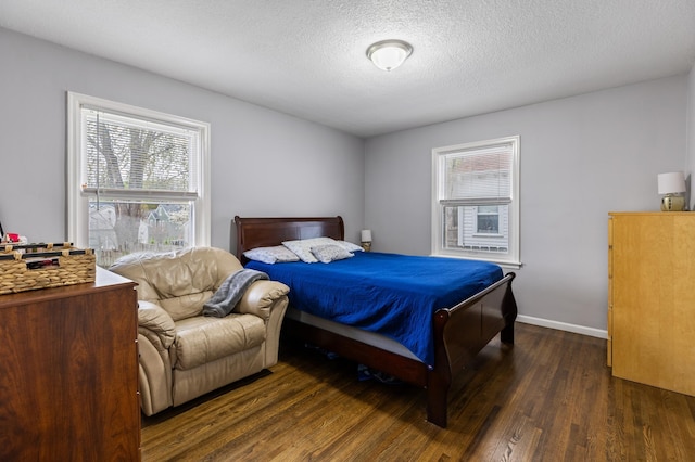 5548 34th Ave S, Minneapolis, MN 55417 - bedroom with dark wood-style flooring, a textured ceiling, and baseboards