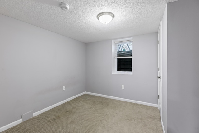 5548 34th Ave S, Minneapolis, MN 55417 - spare room with a textured ceiling, light colored carpet, baseboards, and a smoke detector