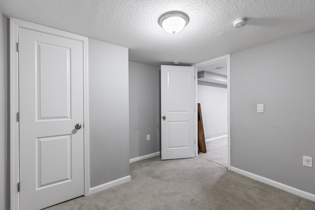 5548 34th Ave S, Minneapolis, MN 55417 - unfurnished bedroom with carpet flooring, a textured ceiling, and baseboards