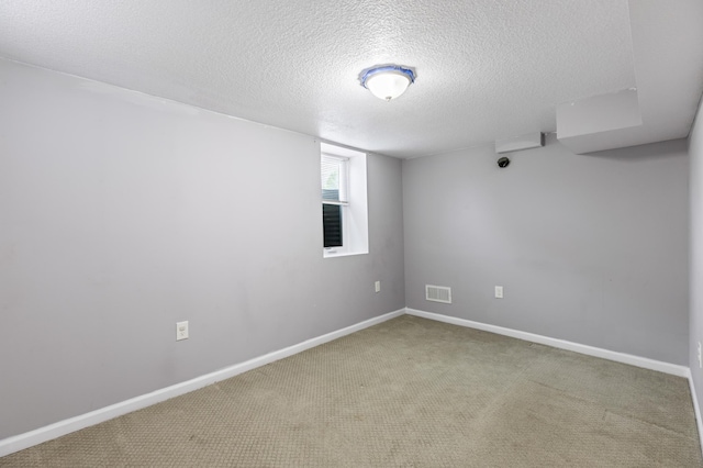 5548 34th Ave S, Minneapolis, MN 55417 - spare room with a textured ceiling, carpet floors, and baseboards