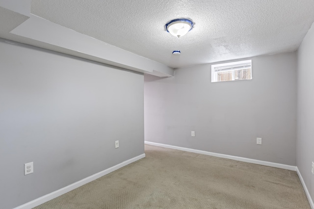 5548 34th Ave S, Minneapolis, MN 55417 - below grade area featuring a textured ceiling, carpet, and baseboards