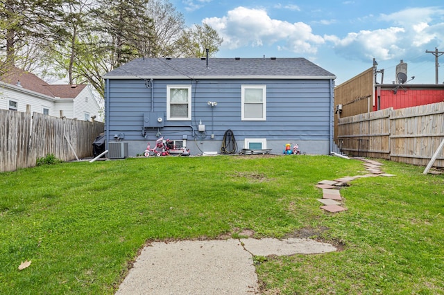 5548 34th Ave S, Minneapolis, MN 55417 - rear view of house with a shingled roof and central AC
