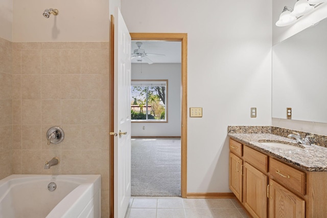 full bathroom with a ceiling fan, tile patterned flooring, vanity, shower / bathtub combination, and baseboards