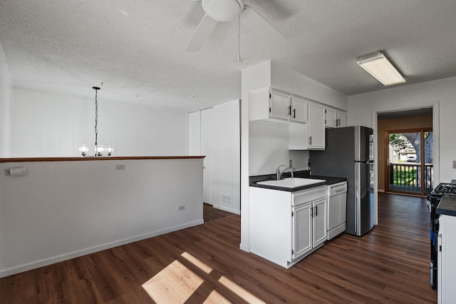 10276 Hanson Blvd NW, Coon Rapids, MN 55433 - kitchen featuring dishwasher, a textured ceiling, dark wood finished floors, dark countertops, and black range with gas stovetop