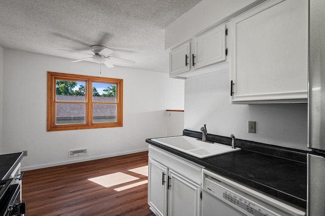 10276 Hanson Blvd NW, Coon Rapids, MN 55433 - kitchen with a sink, white dishwasher, ceiling fan, dark wood-type flooring, and white cabinetry