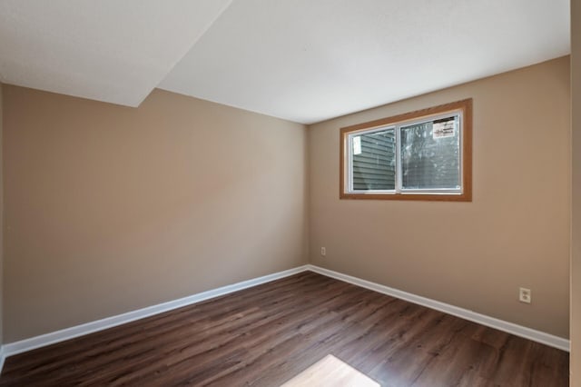 10276 Hanson Blvd NW, Coon Rapids, MN 55433 - empty room with dark wood-style flooring and baseboards