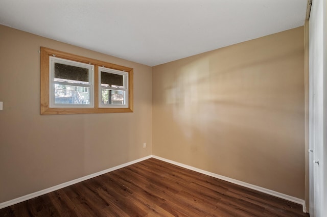10276 Hanson Blvd NW, Coon Rapids, MN 55433 - empty room featuring baseboards and dark wood-style floors