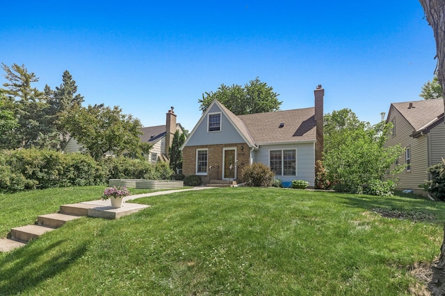3259 Zarthan Ave S, Saint Louis Park, MN 55416 - view of front of house featuring brick siding, a front lawn, and a chimney