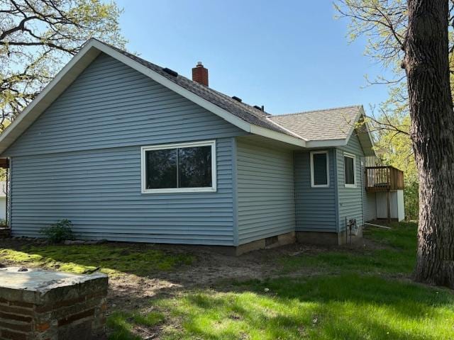 1300 10th St NE, Sauk Rapids Twp, MN 56379 - view of side of property featuring a chimney and roof with shingles