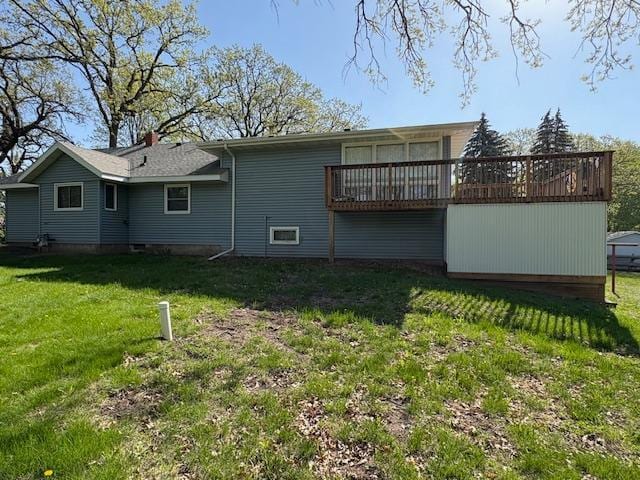 1300 10th St NE, Sauk Rapids Twp, MN 56379 - back of property with a wooden deck and a lawn