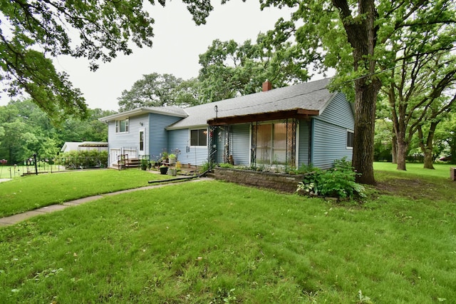 1300 10th St NE, Sauk Rapids Twp, MN 56379 - split level home featuring a front lawn, a chimney, and roof with shingles