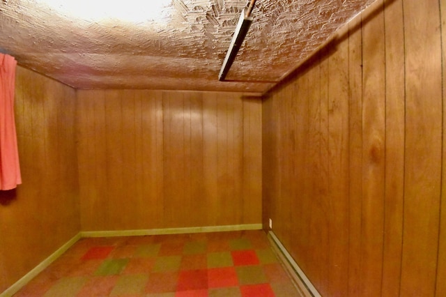 1300 10th St NE, Sauk Rapids Twp, MN 56379 - finished basement featuring tile patterned floors and wood walls