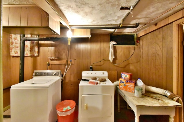 1300 10th St NE, Sauk Rapids Twp, MN 56379 - laundry area featuring washing machine and clothes dryer and wooden walls