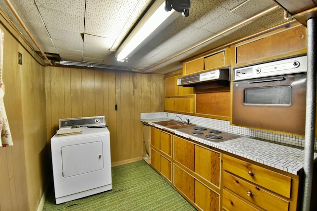 1300 10th St NE, Sauk Rapids Twp, MN 56379 - laundry area featuring washer / clothes dryer and wooden walls