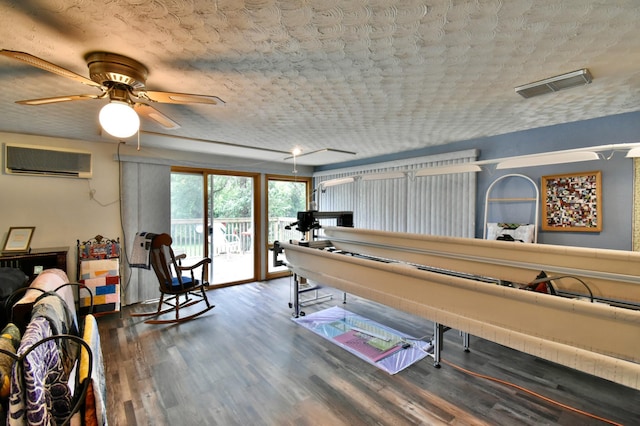 1300 10th St NE, Sauk Rapids Twp, MN 56379 - playroom featuring an AC wall unit, wood finished floors, and ceiling fan