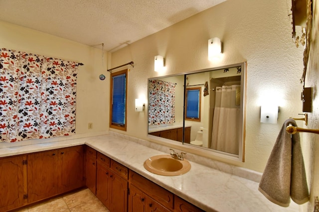 1300 10th St NE, Sauk Rapids Twp, MN 56379 - full bath featuring a textured ceiling, vanity, a textured wall, tile patterned floors, and a shower with curtain