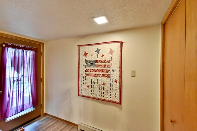 1300 10th St NE, Sauk Rapids Twp, MN 56379 - foyer featuring a textured ceiling and light wood-type flooring