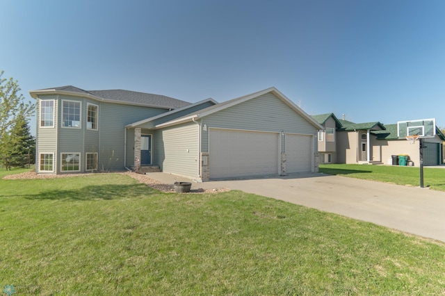 view of front of property featuring a garage, a front lawn, and driveway