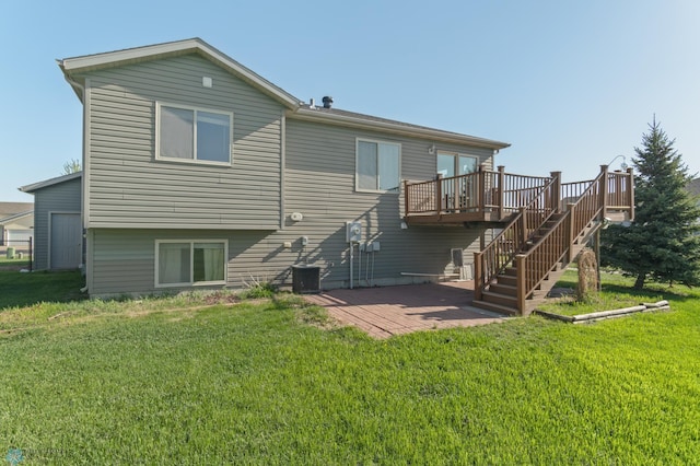 back of house with a deck, a patio, stairs, and a lawn