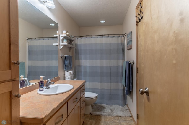 bathroom featuring toilet, vanity, a textured ceiling, curtained shower, and recessed lighting