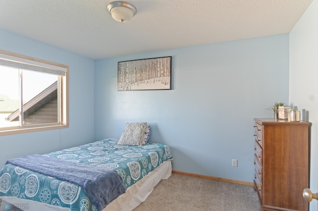carpeted bedroom with baseboards